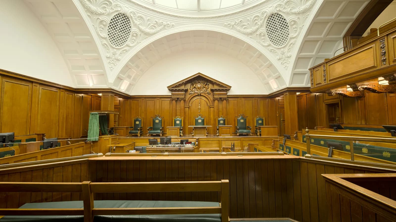 Formal courtroom with judge's bench, representing court interpreting