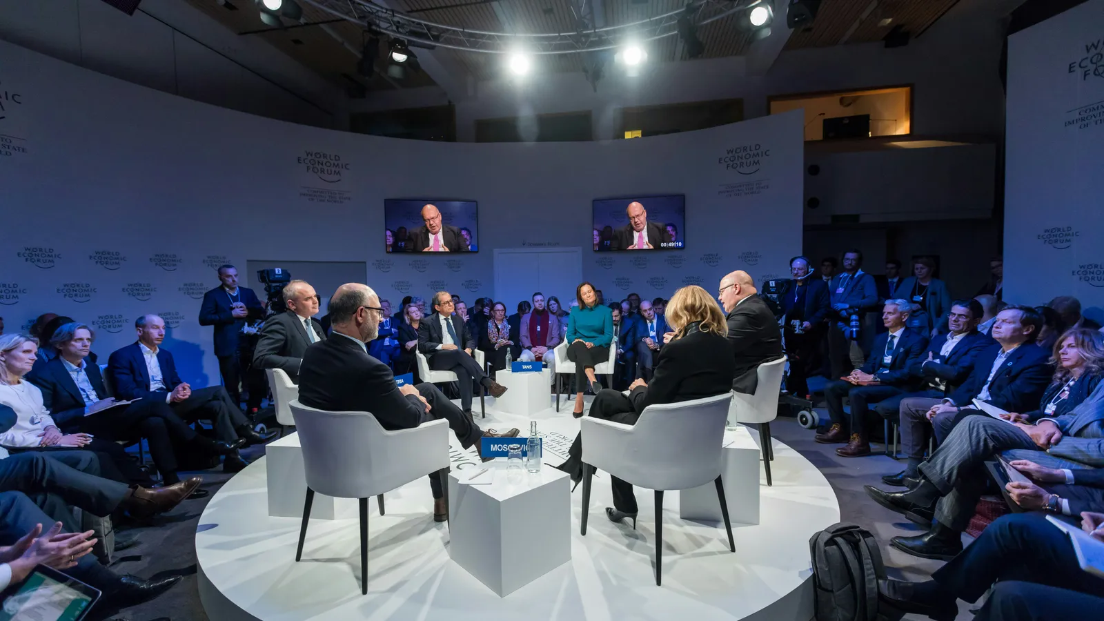 Diplomatic summit panel in Paris in front of an audience, a setting for French interpreters